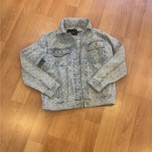 Coach signature denim jacket in a light wash color